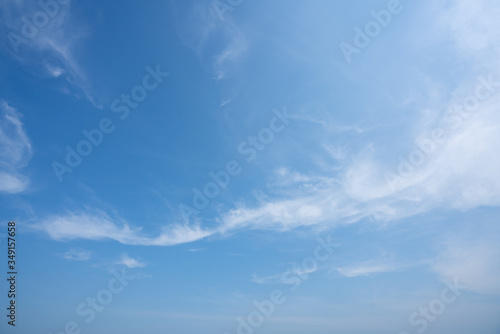 Blue sky with white light clouds in daylight. /background/ sopy space photo