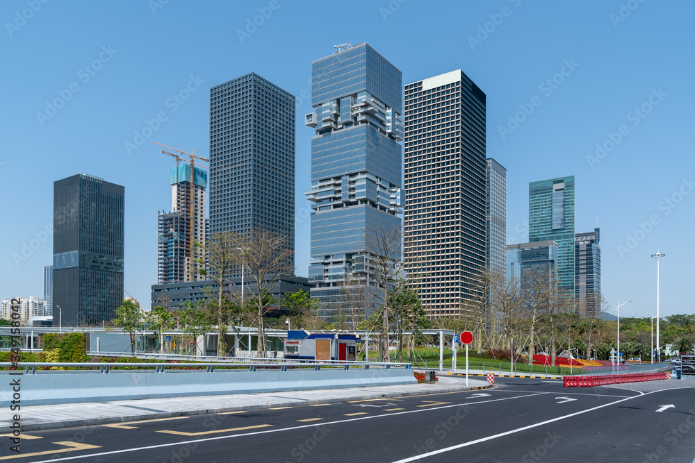 Asphalt floor and urban modern architecture