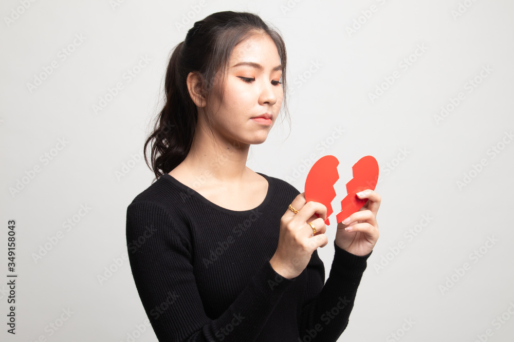 Beautiful young Asian woman with broken heart. Beautiful young Asian woman with broken heart.