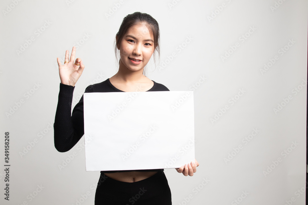 Young Asian woman show OK with white blank sign. Young Asian woman show OK with white blank sign.