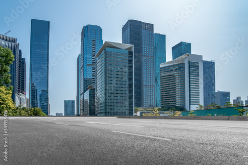 Asphalt floor and urban modern architecture