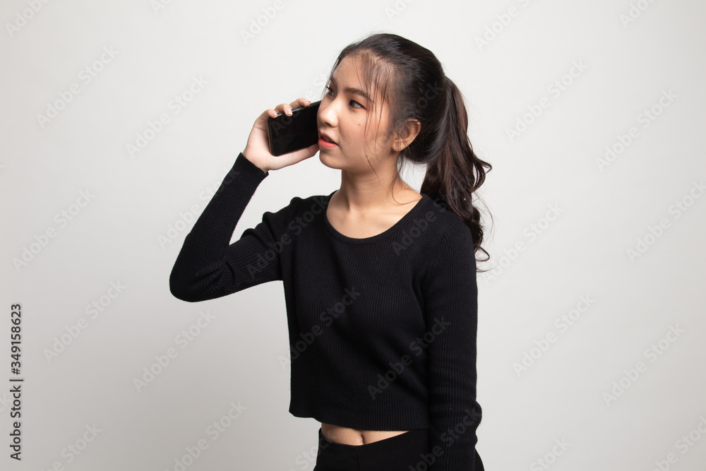 Fototapeta premium Young Asian woman talking with mobile phone.