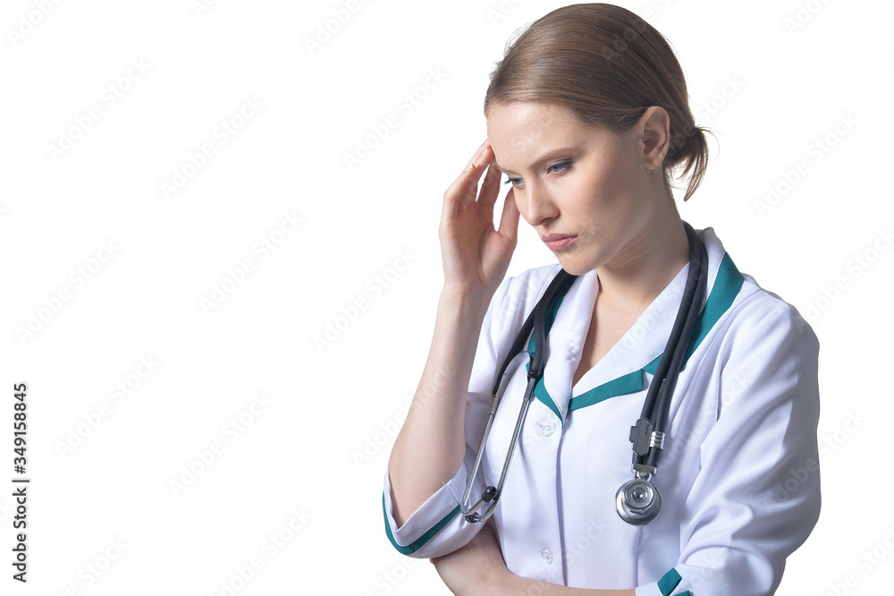 Portrait of female thinking doctor posing on white Portrait of female thinking doctor posing on white