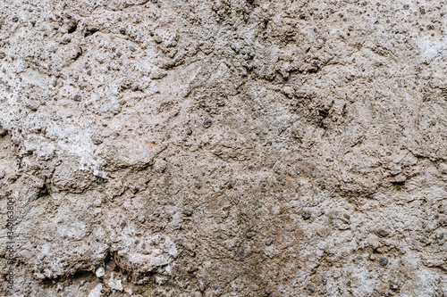 Old dirty wall uneven texture. Vintage or grungy white background of natural cement & stone texture as retro pattern wall. It is a concept design. Metaphor banner, material aged, rust or construction.