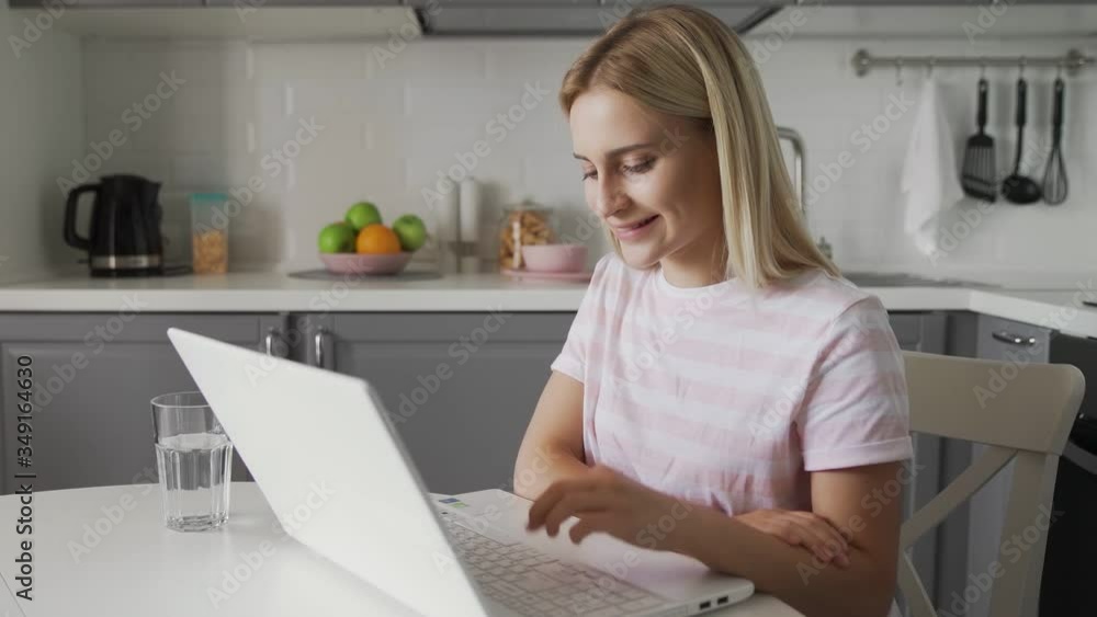 Happy woman finished talking at computer. Smiling person having online chat Happy woman finished talking at computer. Smiling person having online chat