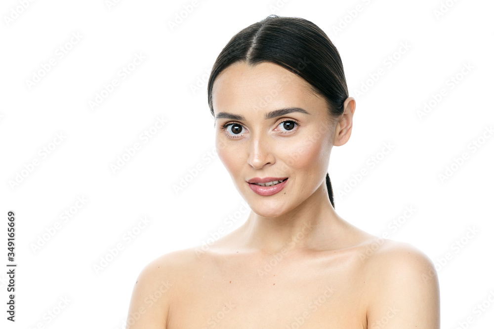 Beautiful smiling woman with clean skin, natural make-up, and white teeth on white background Beautiful smiling woman with clean skin, natural make-up, and white teeth on white background