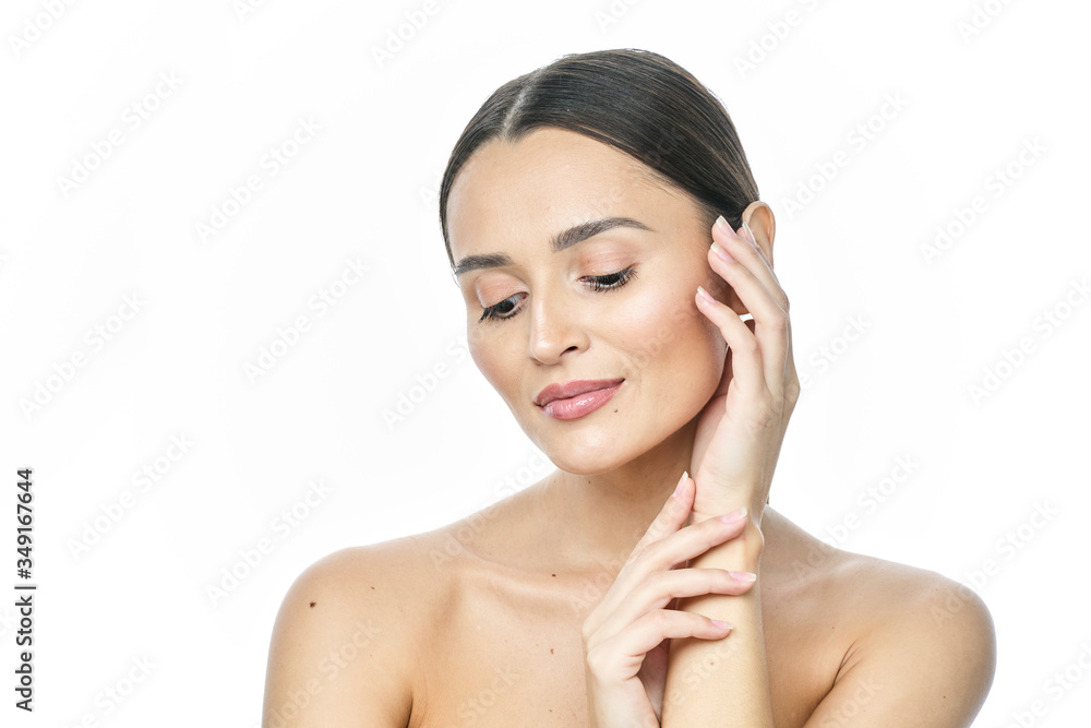 Beautiful smiling woman with clean skin, natural make-up, and white teeth on white background Beautiful smiling woman with clean skin, natural make-up, and white teeth on white background