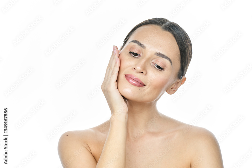 Beautiful smiling woman with clean skin, natural make-up, and white teeth on white background Beautiful smiling woman with clean skin, natural make-up, and white teeth on white background