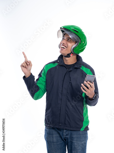 man rider wear helmet pointing to blank copyspace