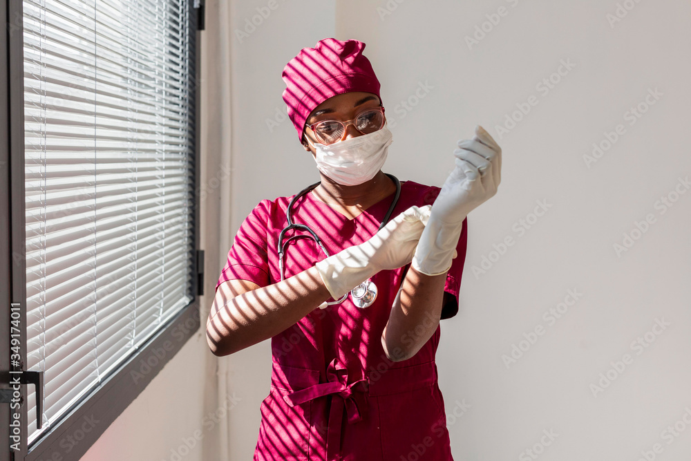Specialist female doctor wearing gloves. Black health professional, afro american doctor, african nurse. Specialist female doctor wearing gloves. Black health professional, afro american doctor, african nurse.