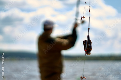 Billede på lærred throwing a filled feeder . Closeup of feeder fishing