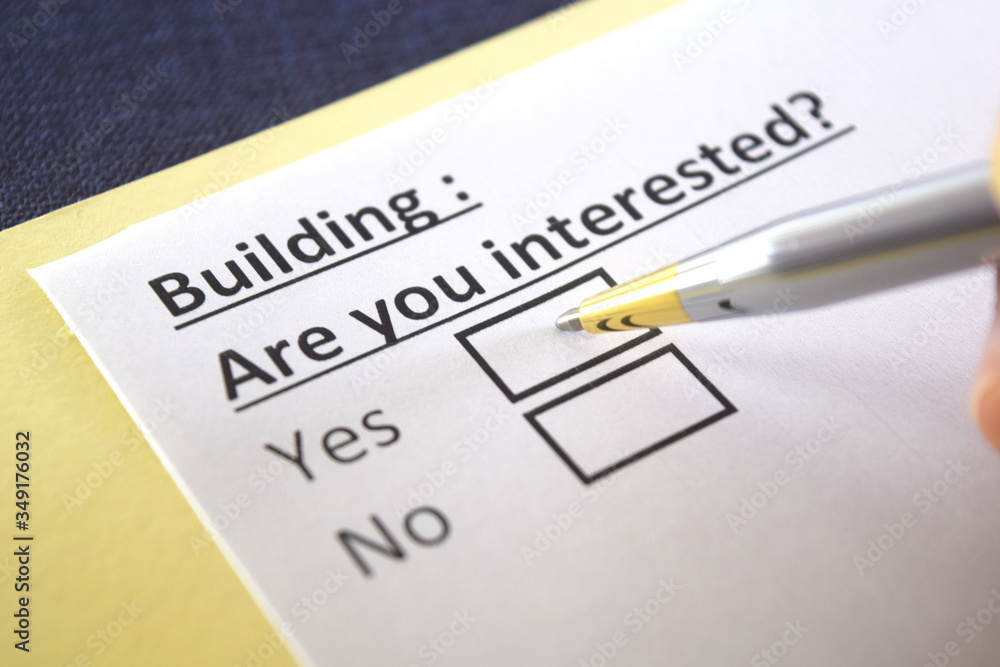 One person is answering question about building. One person is answering question about building.
