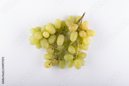 bunch of green grapes close-up on a white background