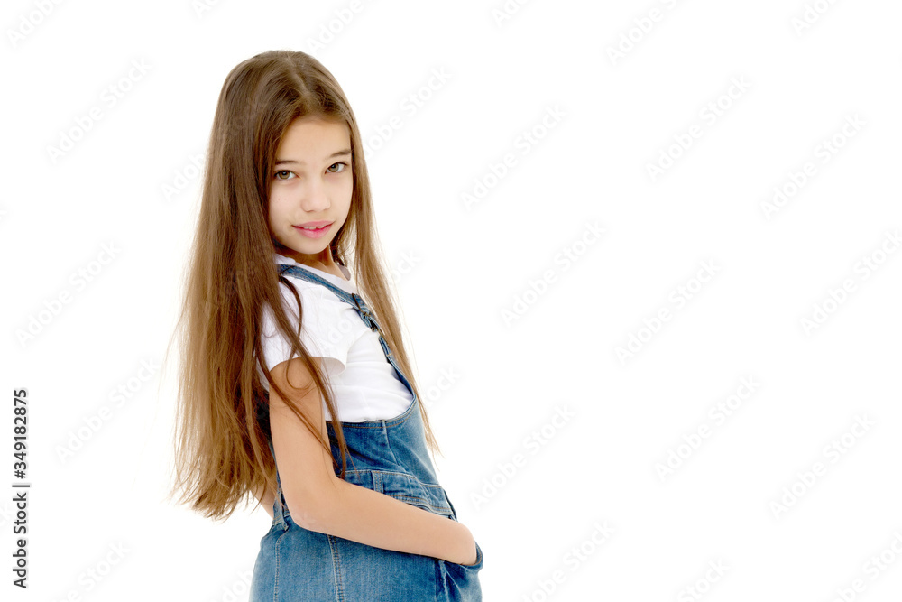 Little girl in a short denim dress. Little girl in a short denim dress.
