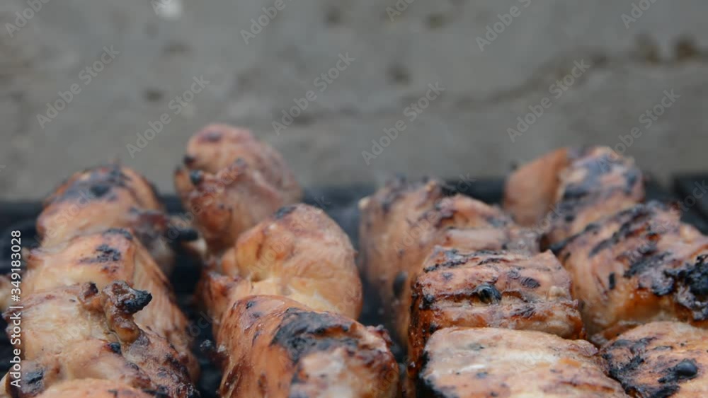 close up bbq chiken hearts and meat in smoke. close up bbq chiken hearts and meat in smoke.