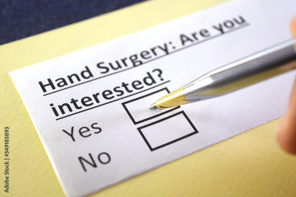 One person is answering question about hand surgery. One person is answering question about hand surgery.