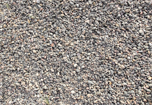 Fine gravel texture or gravel background for the design. Sea or river pebbles. Fine stone for building and mixing concrete.