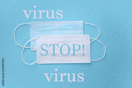 disposable blue face masks to stop virus on a blue background