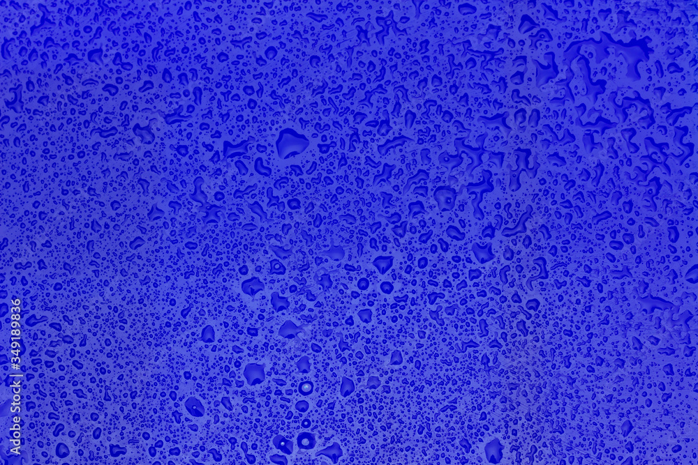 Drops of water on a green surface Drops of water on a green surface