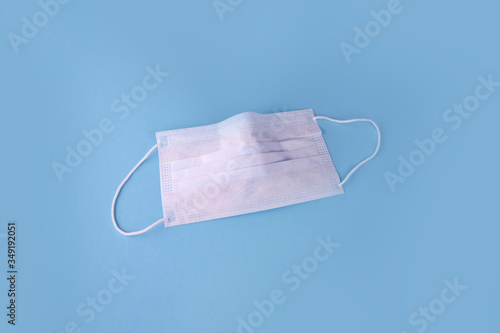 Medical mask, Medical protective masks on blue background. Disposable surgical face mask cover the mouth and nose. Healthcare and medical concept. COVID-19