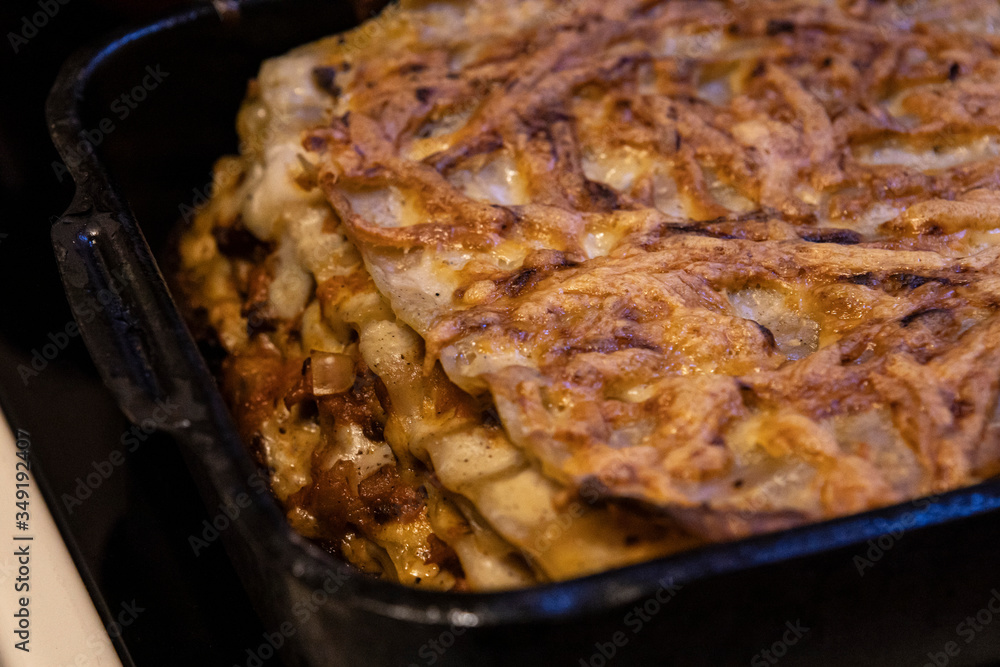 Cooked lasagna in pan for oven. Italian home cooking Cooked lasagna in pan for oven. Italian home cooking