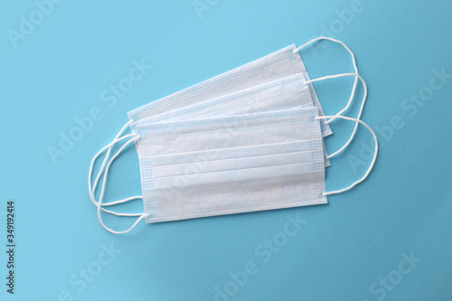 Medical mask, Medical protective masks on blue background. Disposable surgical face mask cover the mouth and nose. Healthcare and medical concept. COVID-19