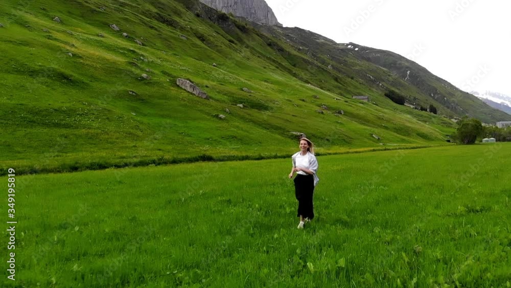 Slow motion of happy and carefree female tourist enjoying natural environment in mountains with scenery nature landscape.Happy young woman 20 years old running on green grass feeling freedom
Slow motion of happy and carefree female tourist enjoying natural environment in mountains with scenery nature landscape.Happy young woman 20 years old running on green grass feeling freedom