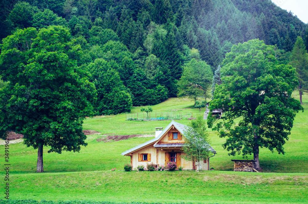 A small wooden house in the mountains.