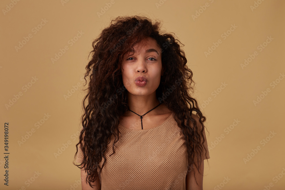 Sweaty woman with wavy brown hairs dressed in underwear Stock Photo by  fxquadro