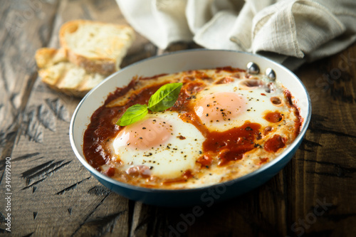 Fried eggs with tomato sauce or shakshuka