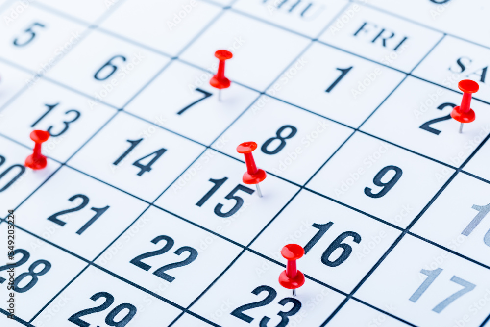 2020 calendar page marked with an important date in red pin. timeline, time, concept, idea, management 2020 calendar page marked with an important date in red pin. timeline, time, concept, idea, management