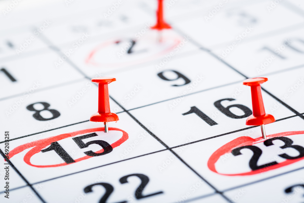 2020 calendar page marked with an important date in red pin. timeline, time, concept, idea, management 2020 calendar page marked with an important date in red pin. timeline, time, concept, idea, management