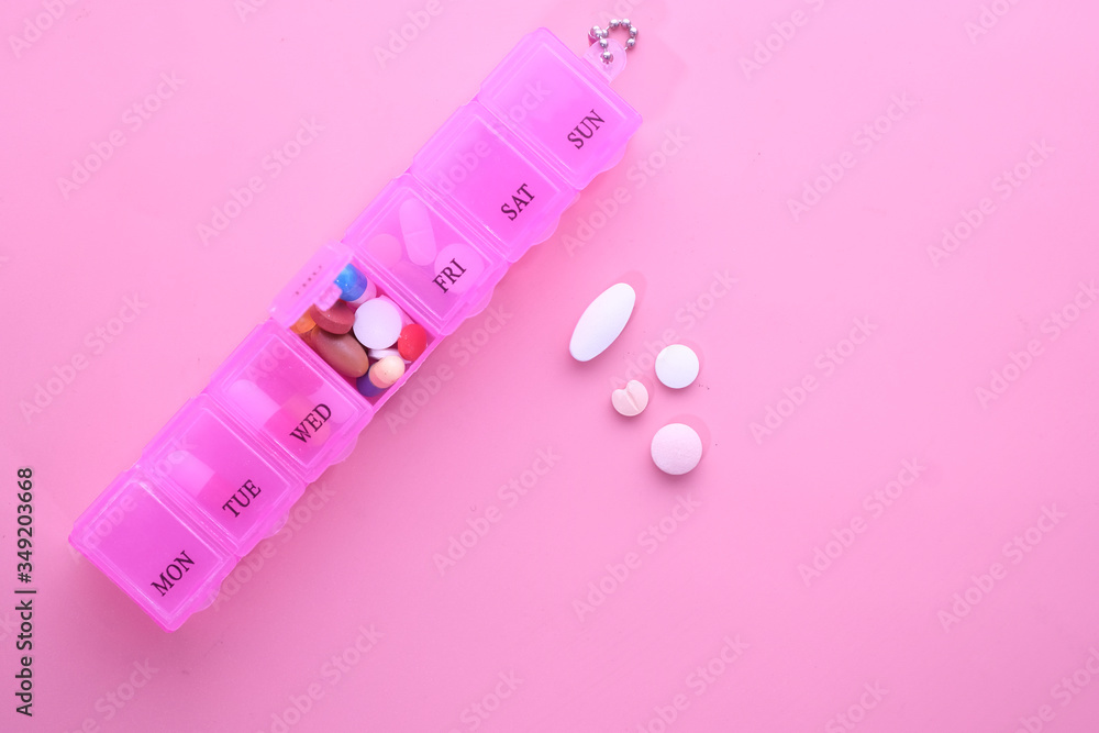Top view of colorful pills in a pill box Top view of colorful pills in a pill box
