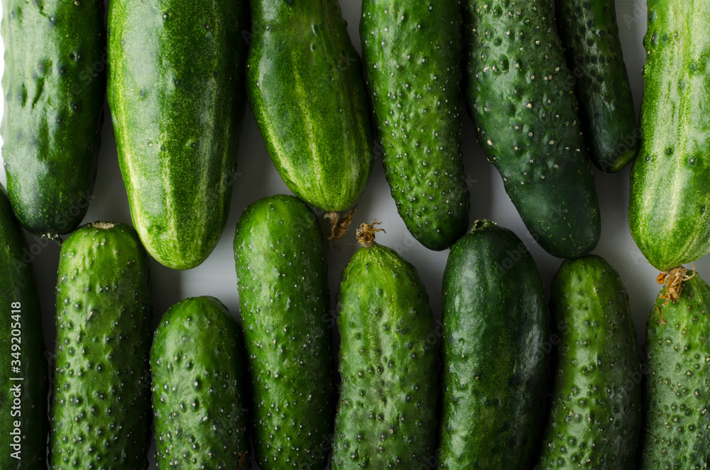 Top view of rows of fresh organic cucumber as a background Top view of rows of fresh organic cucumber as a background