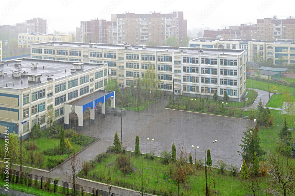 Empty schoolyard during heavy rain in spring. Moscow, Russia Empty schoolyard during heavy rain in spring. Moscow, Russia