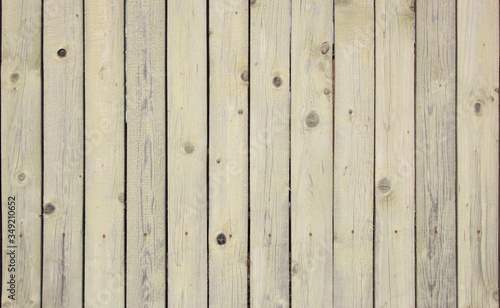 background fence from wooden boards painted gray with white