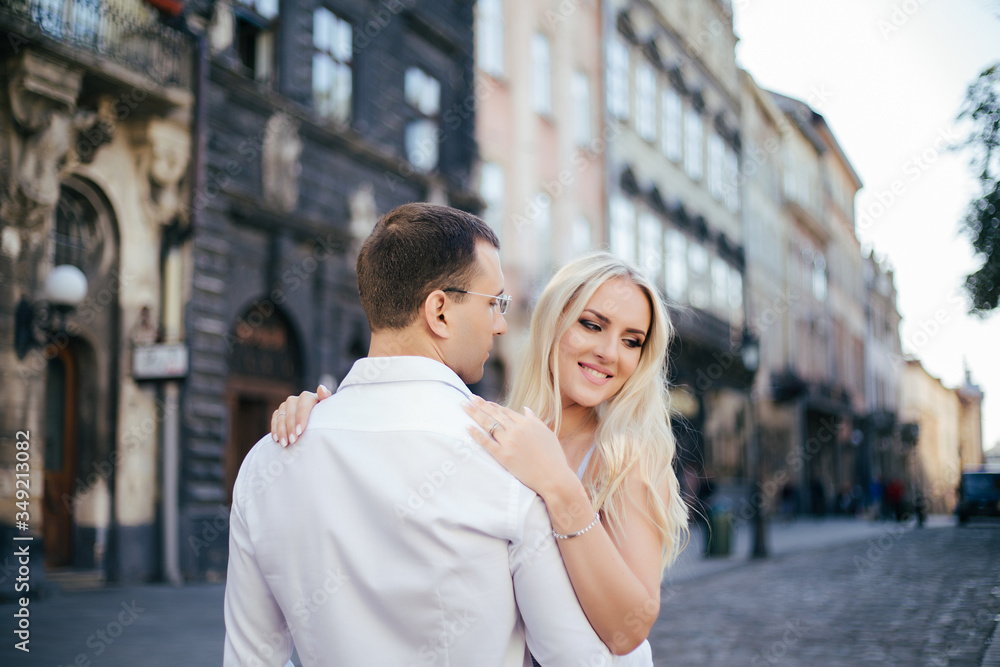 Smiling couple in love outdoors, lviv. summer Smiling couple in love outdoors, lviv. summer
