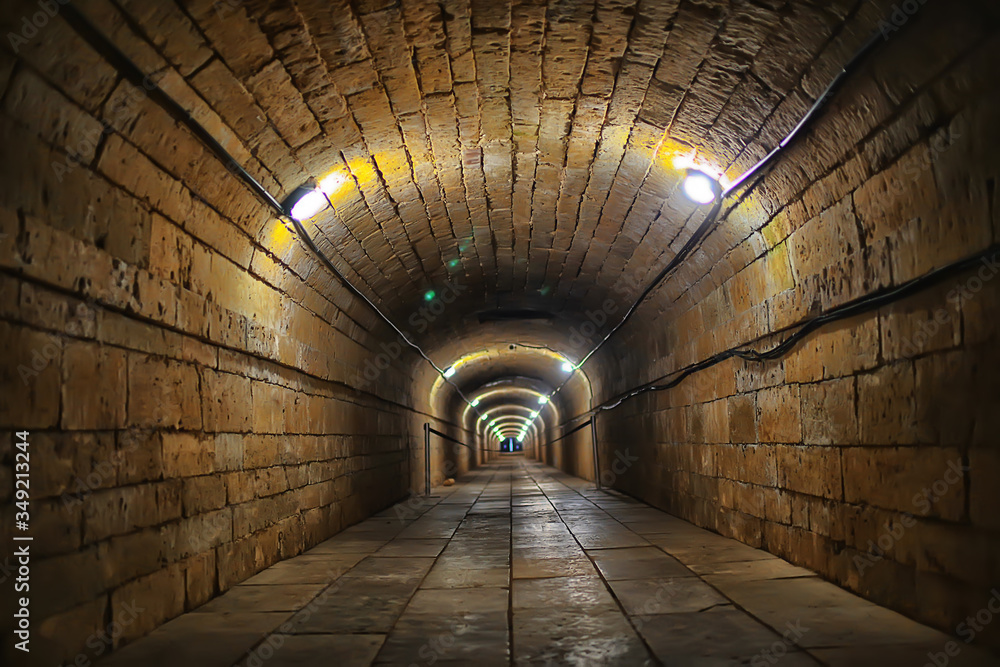 Obraz premium castle tunnel view, gloomy underground passage perspective, old european castle, abstract view