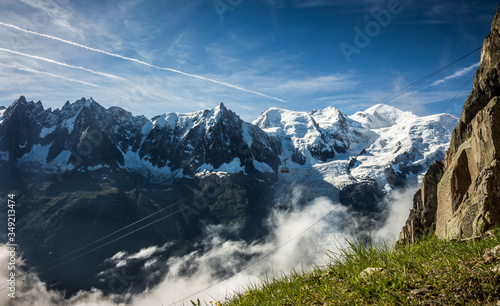 Brevent cable car suspended in the air, with stunning Mont Blanc massif summer view in the background