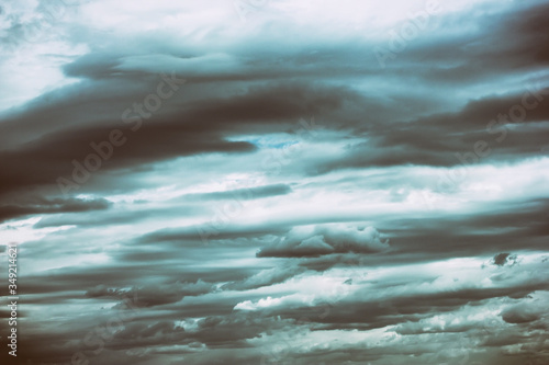 Dark cloudy gloomy sky. Retro style skyscape card. Abstract nature background