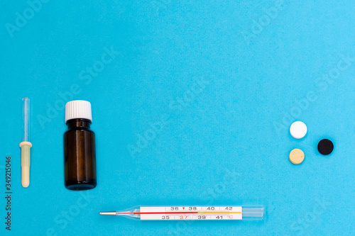 Medical products for the treatment of diseases on a blue background. Top view. Copy space. Flat lay