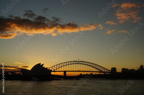 sydney harbour bridge and opera house at sunset