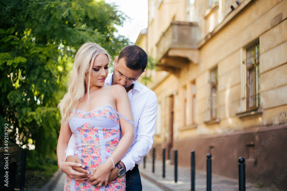 Smiling couple in love outdoors, lviv. summer Smiling couple in love outdoors, lviv. summer
