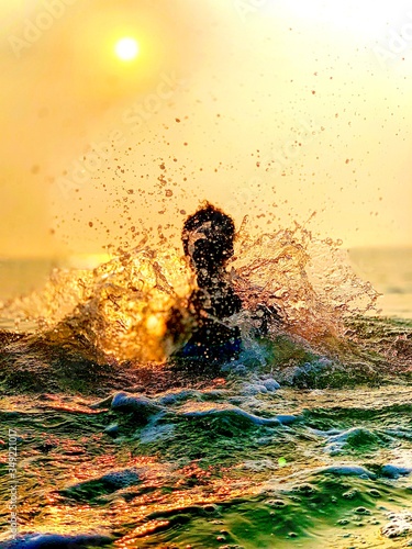 silhouette of a man in the sea © Sennai