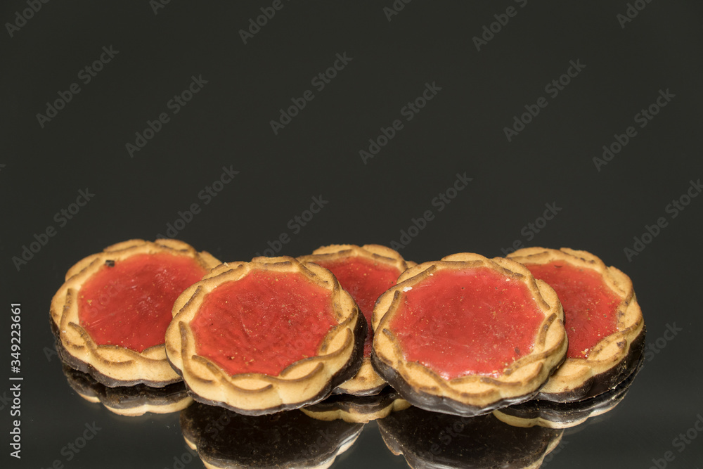 Cookies with jam on a mirror black background Cookies with jam on a mirror black background