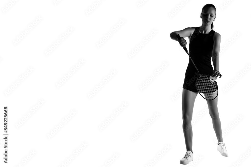Pretty woman playing badminton over white background