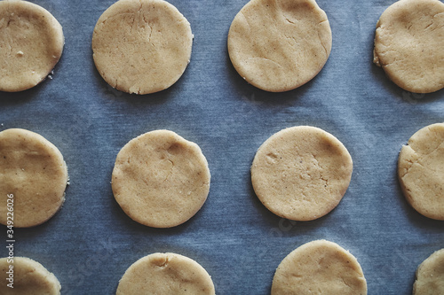 Round pieces of shortbread dough for making cookies or gingerbread