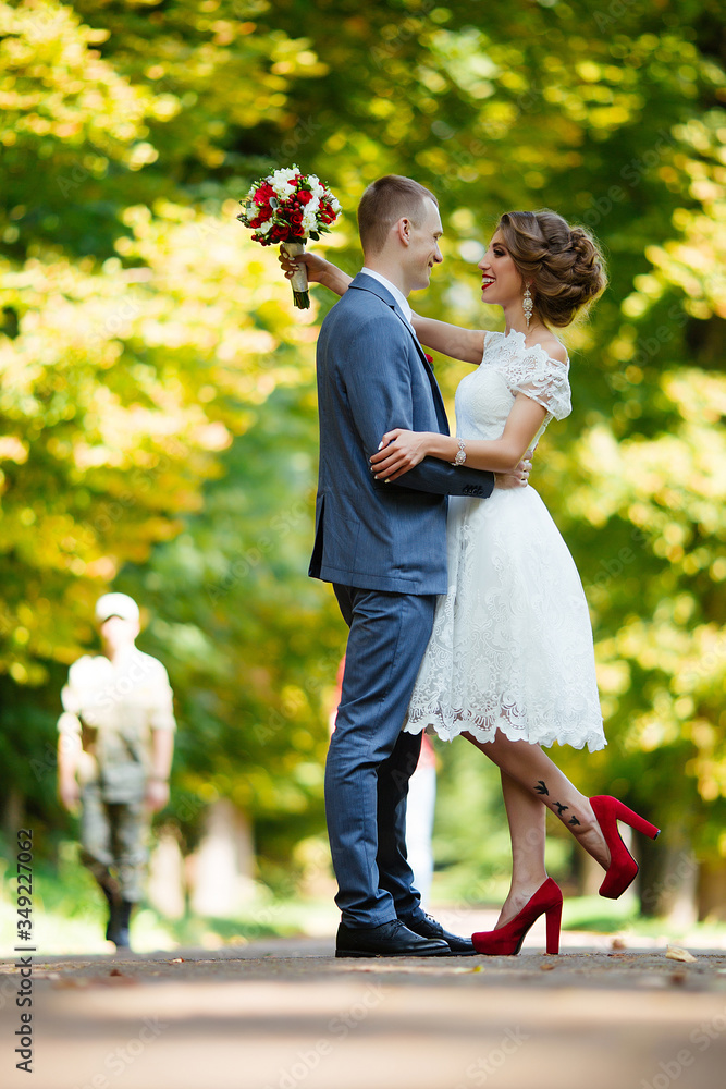 Fototapeta premium Wedding. Young couple, recently married, holding hands