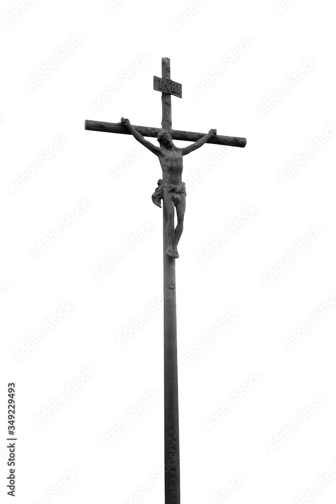 Bottom view of ancient iron statue of the crucifixion of Jesus Christ against white background.