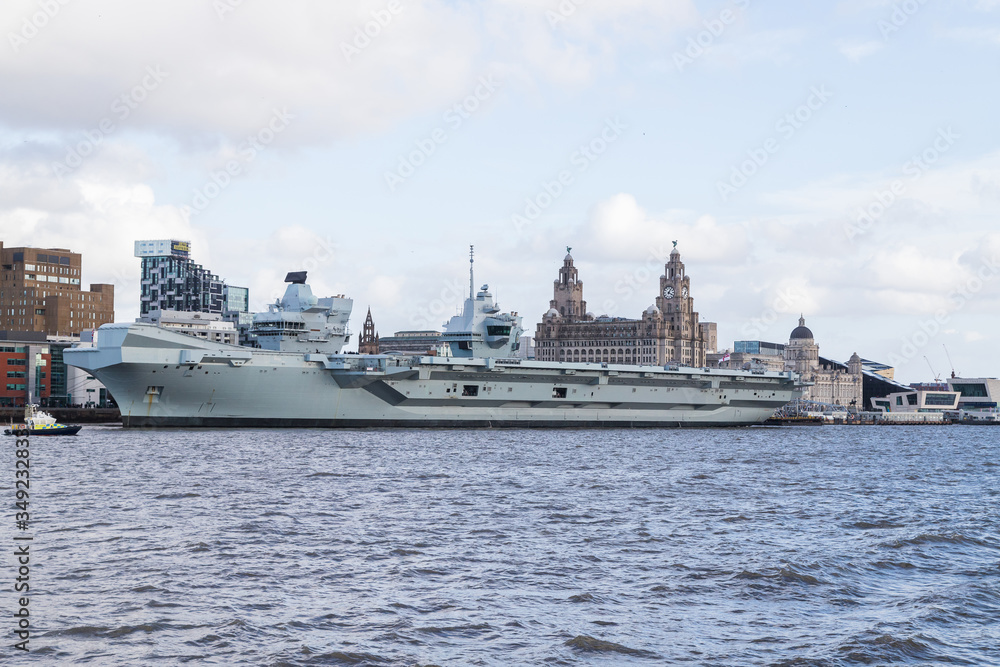 HMS Prince of Wales in front of the Liverpool waterfront